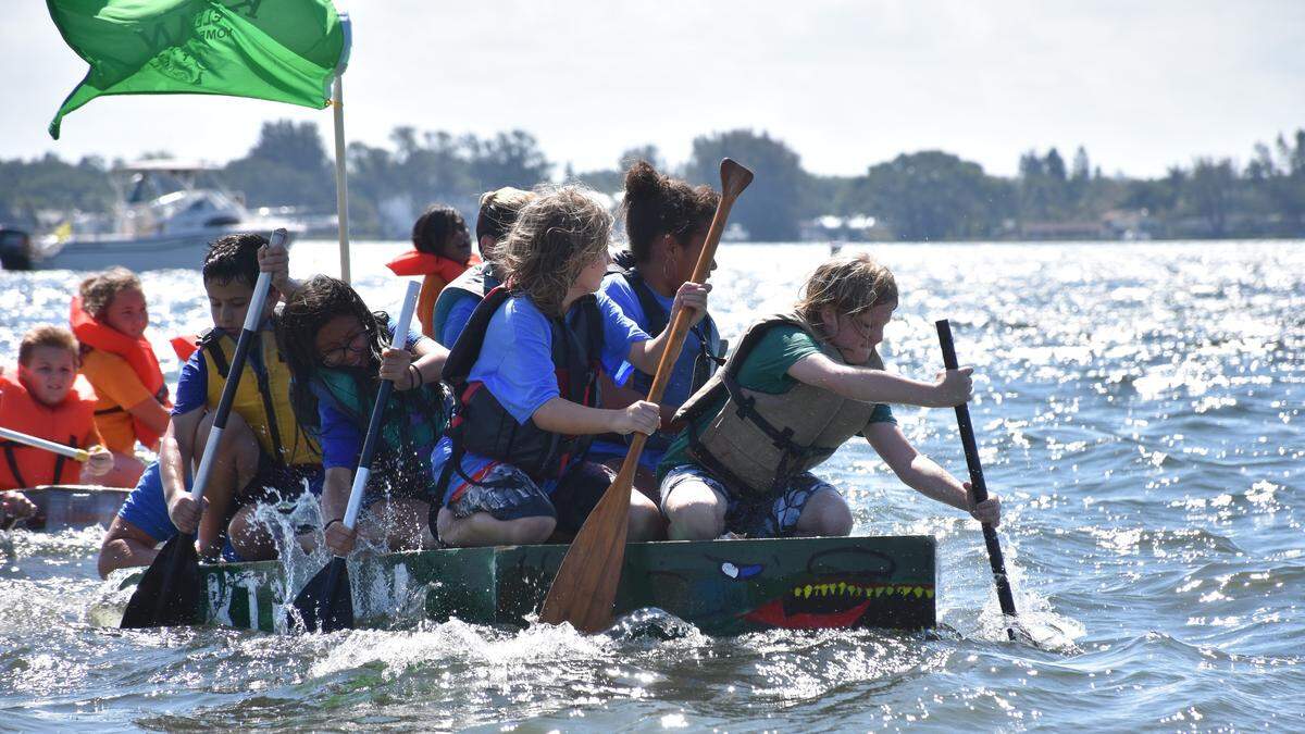 A team of elementary school students compete during the 2019 Bottle Boat Regatta Saturday morning.