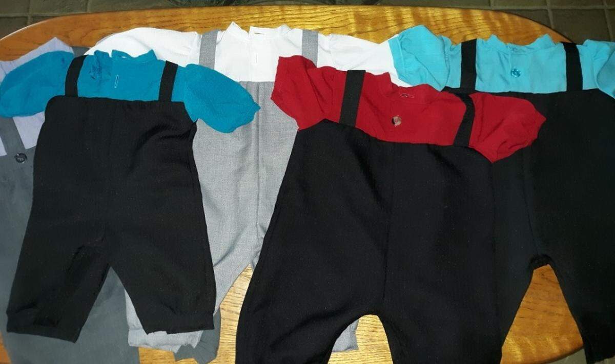 Baby Ryan received several Amish outfits as gifts. Amish boys typically wear solid-colored pants with suspenders and a solid-colored shirt.