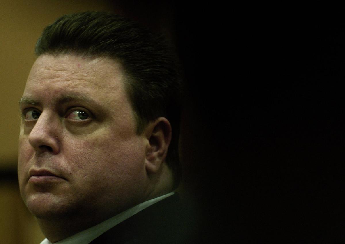 Joseph Smith looks at his public defender while listening to testimony on the first day of his trial, for the abduction and killing of 11 year-old Carlie Brucia, at the Sarasota County Judicial Center in Sarasota, Fl., Monday, Nov. 7, 2005.