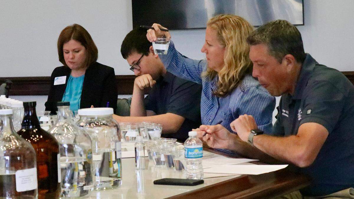 From left, judge Tara Poulton, Ethan Greenbaum, Mandi Rice and George Kruse judge samples during an annual drinking water competition March 25, 2022, among six regional water utilities.