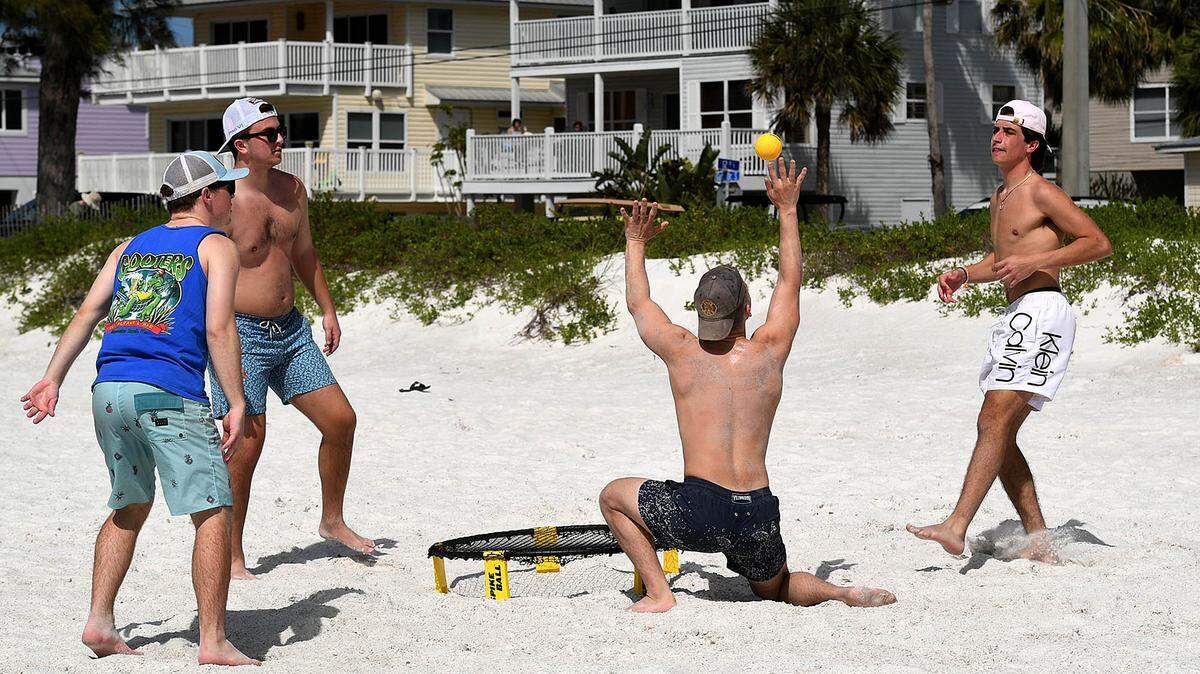 College students on spring break from a college in North Carolina enjoy the warm weather at Cortez Beach on Anna Maria Island in 2021.
