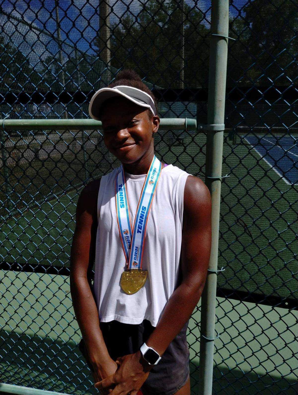Braden River freshman Chukwunoneeru Smarty poses with her gold medal after winning the FHSAA Class 3A individual girls tennis state championship in Altamonte Springs on Thursday, May 2, 2024.