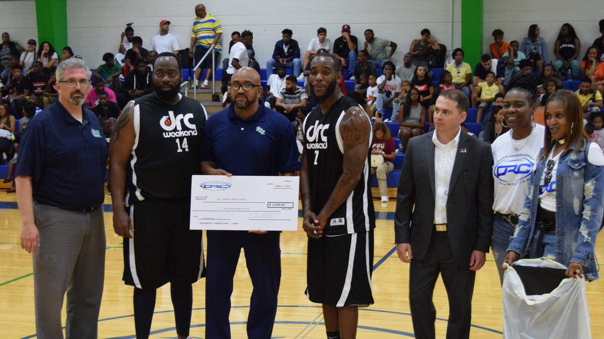 State College of Florida has parted ways with head basketball coach Elliot Washington, who is seen here (third from left) during halftime of the 10th annual Dominique Rodgers-Cromartie celebrity basketball game on Saturday, April 7, 2018 at SCF.