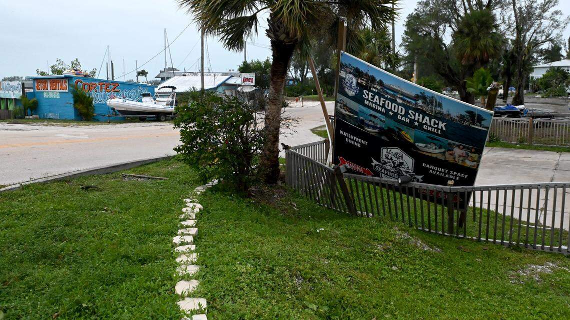 A sign for the Seafood Shack came loose during Hurricane Ian in Bradenton on Sept. 29, 2022.