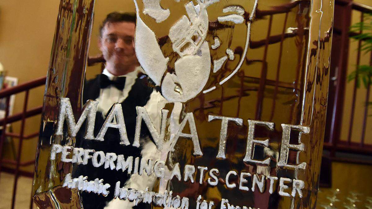Dylan Mailloux stands ready to serve drinks poured through a large ice sculpture at the Manatee Performing Arts Center's Crystal Gala Saturday night.TIFFANY TOMPKINS-CONDIE/Bradenton Herald