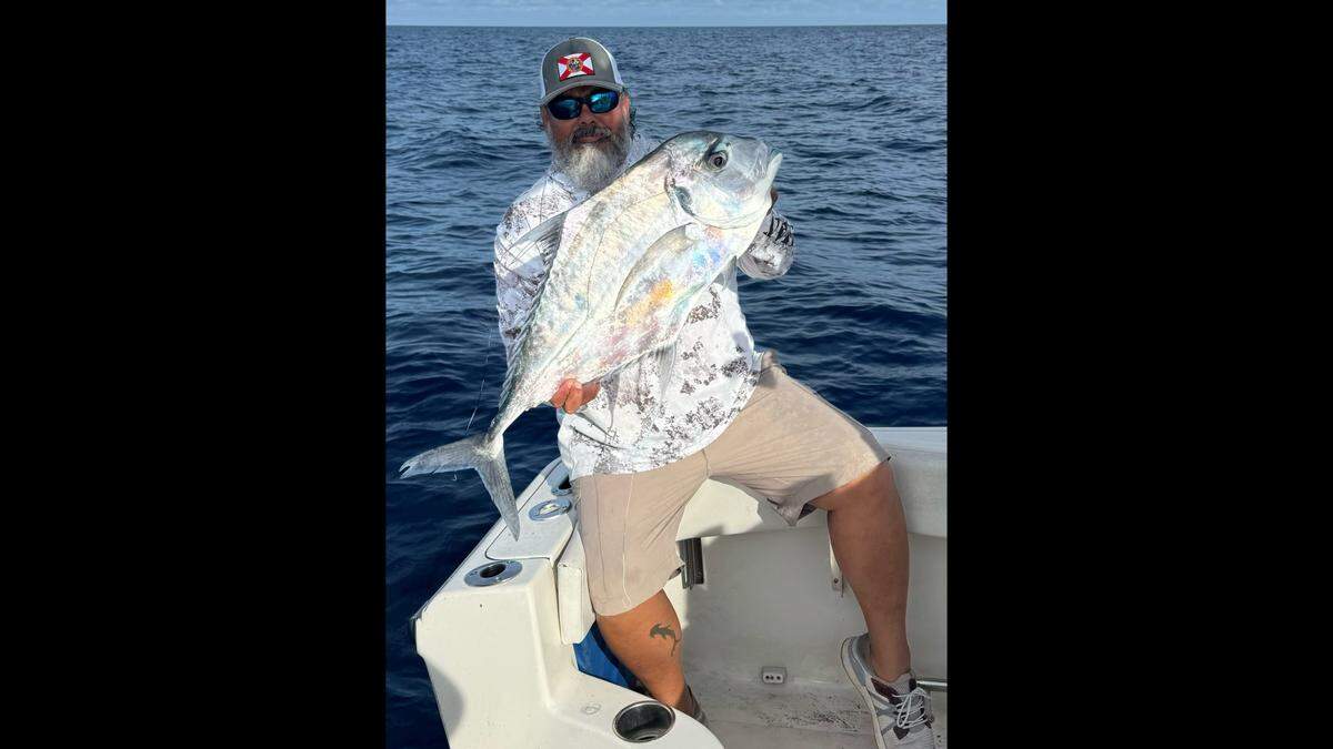 Local angler Danny Trevino poses with an African pompano caught fishing 60 miles west of Tampa Bay.