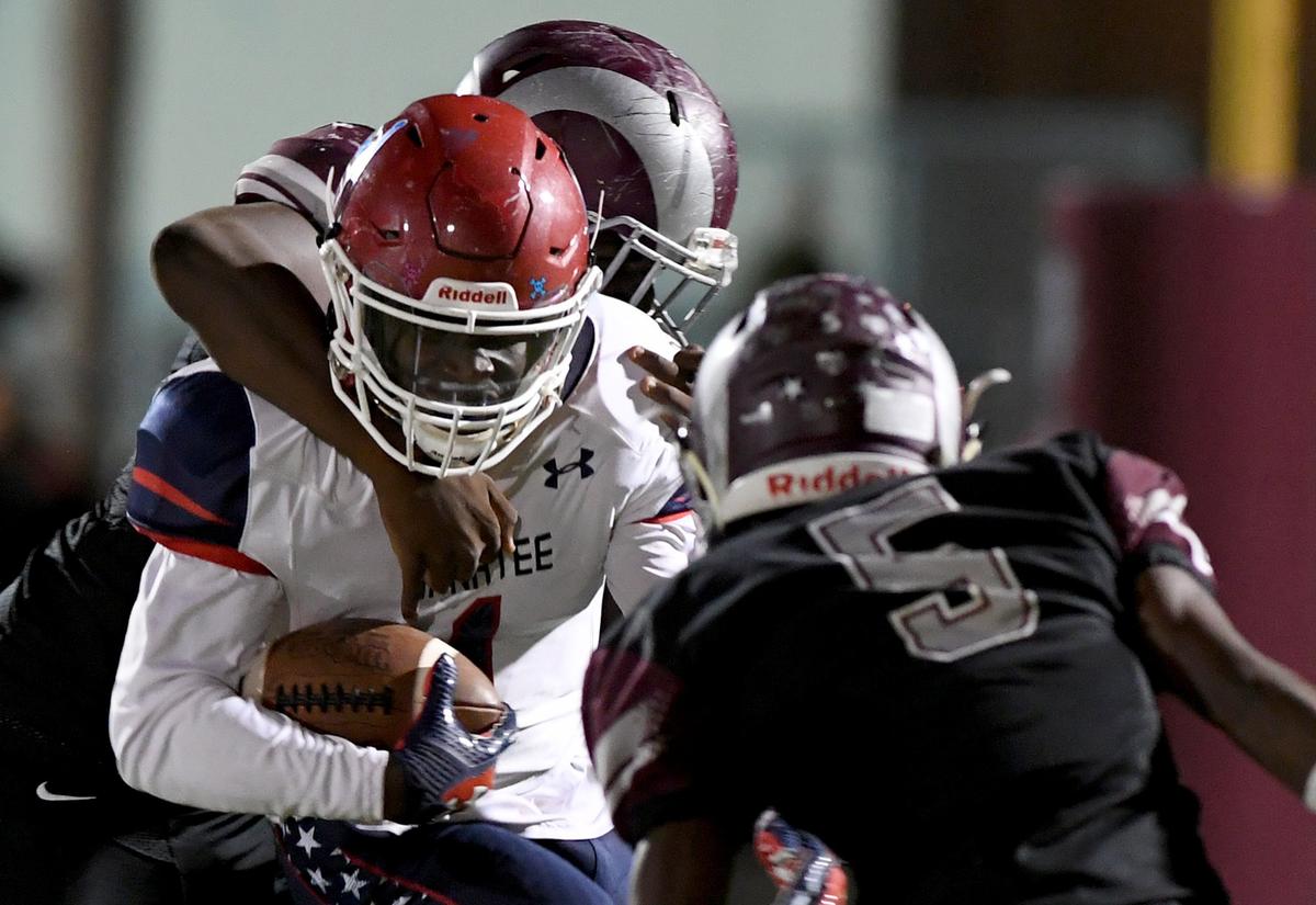 Manatee’s Keyon Fordham is set upon by Riverview’s defense during Friday night’s Class A Region 2 semifinals between Manatee and Riverview at Riverview.