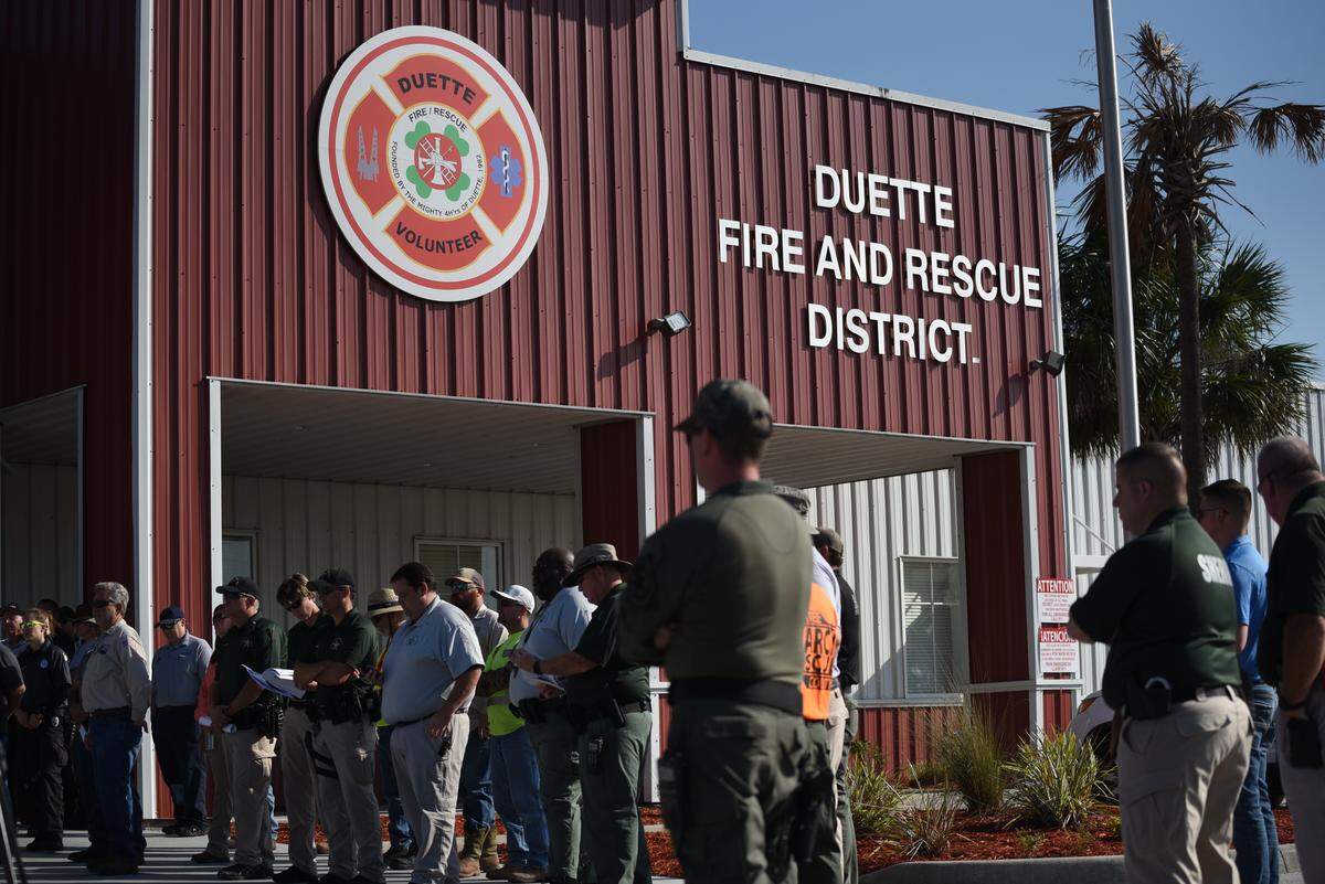 First responders huddle at the Duette Fire and Rescue District Tuesday for a tornado drill Tuesday.