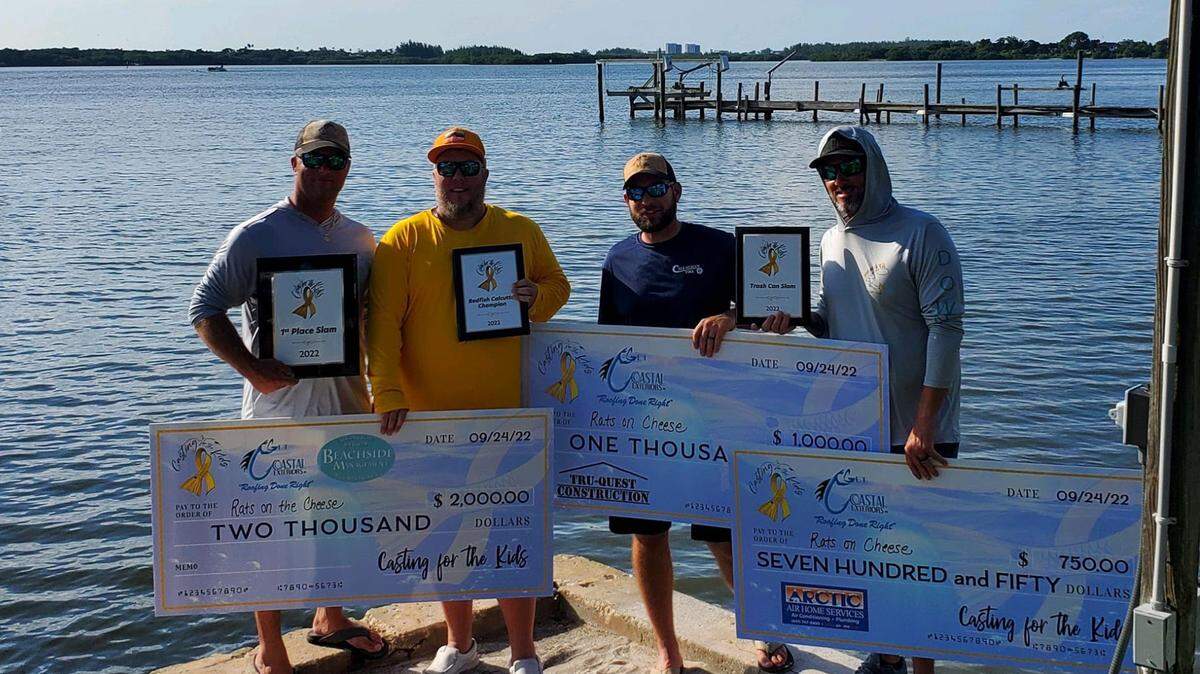 Keith David Stonestreet posses with his teammates Matt Mangone, Justin Rudrud and Rich Linkenhoker of Callahan Tires/Rats On Da Cheese during the 2022 Casting for the Kids Fishing Tournament.