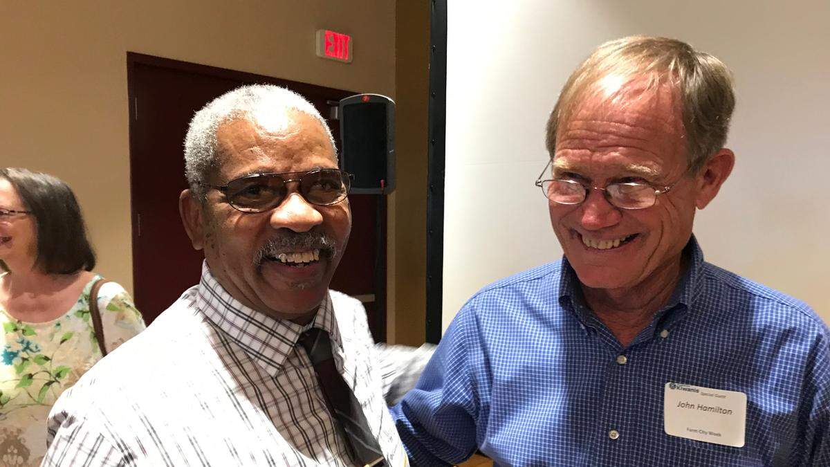 John Lewis Hamilton, the 2018 Outstanding Agriculturist, is congratulated by 2012 award recipient Ervin Shannon, left.