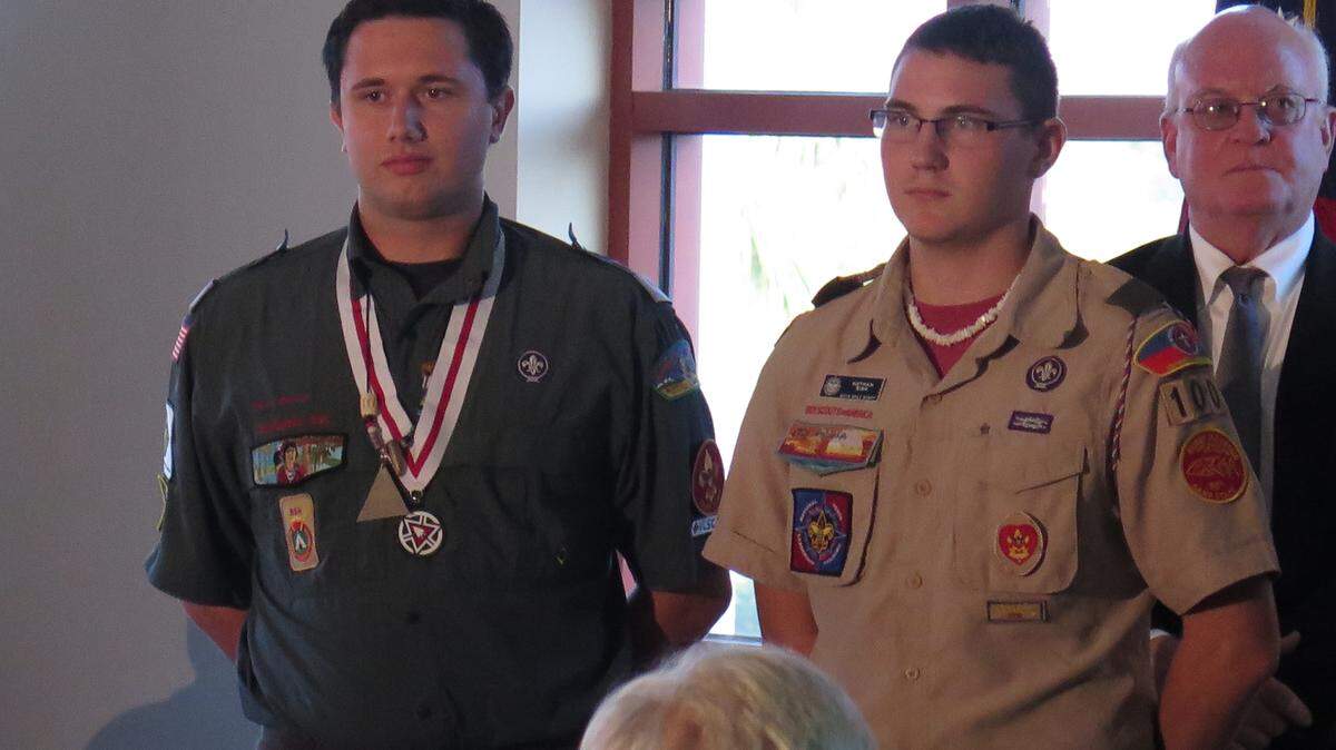 From left: Boy Scout Caleb Savage, assistant scout master for Troop 77, and Nathan Sisk of Troop 100, stand Thursday before receiving national Boy Scouts of America certificates of merit for saving a young boy and an adult in a boating accident earlier this year.AMARIS CASTILLO/Bradenton Herald