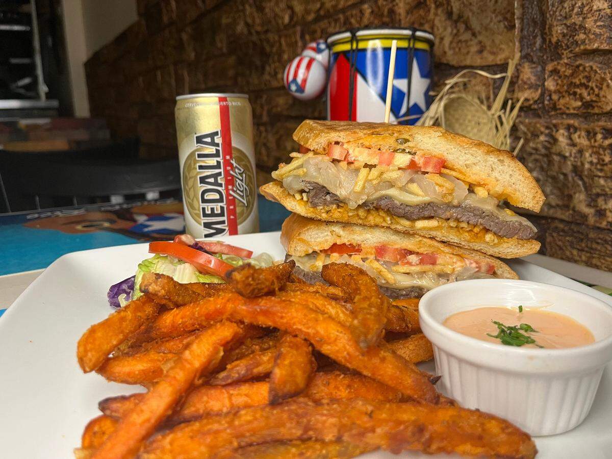 A panfried steak with sweet potato fries is a menu offering at Casa Tino.