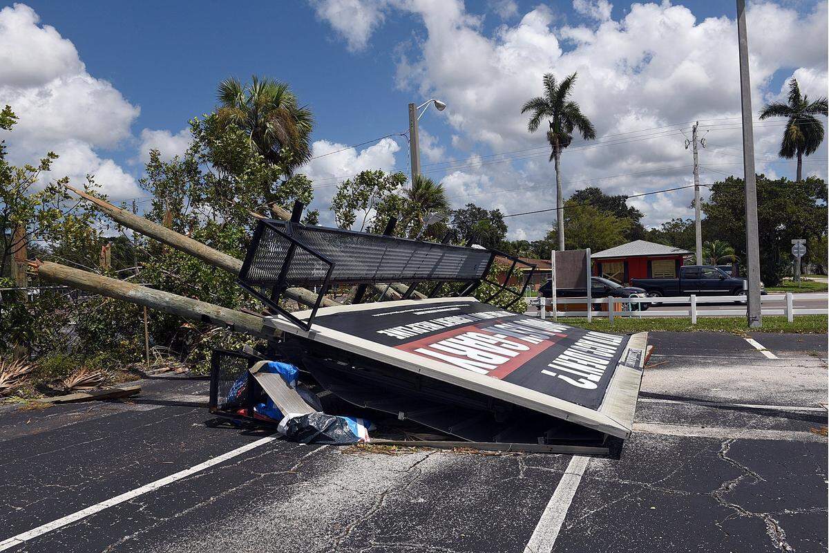 A large billboard lies on the ground off 14th Street West Tuesday after Hurricane Irma.