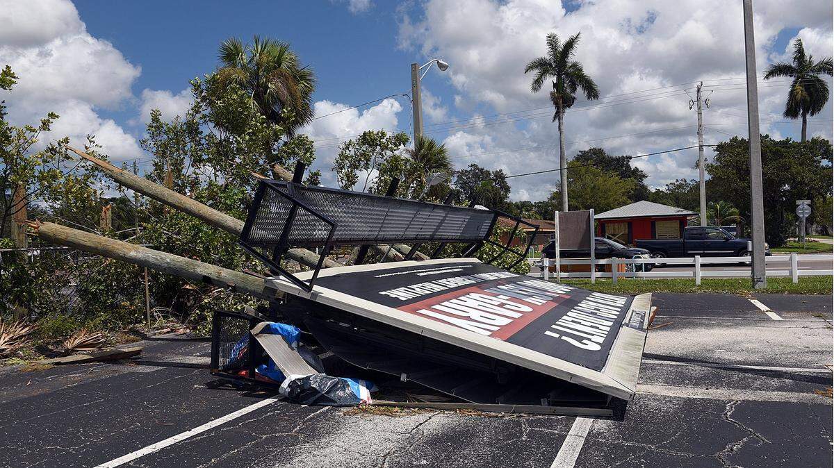 A large billboard lies on the ground along 14th Street West in Bradenton after Hurricane Irma passed through Manatee County in September 2017.