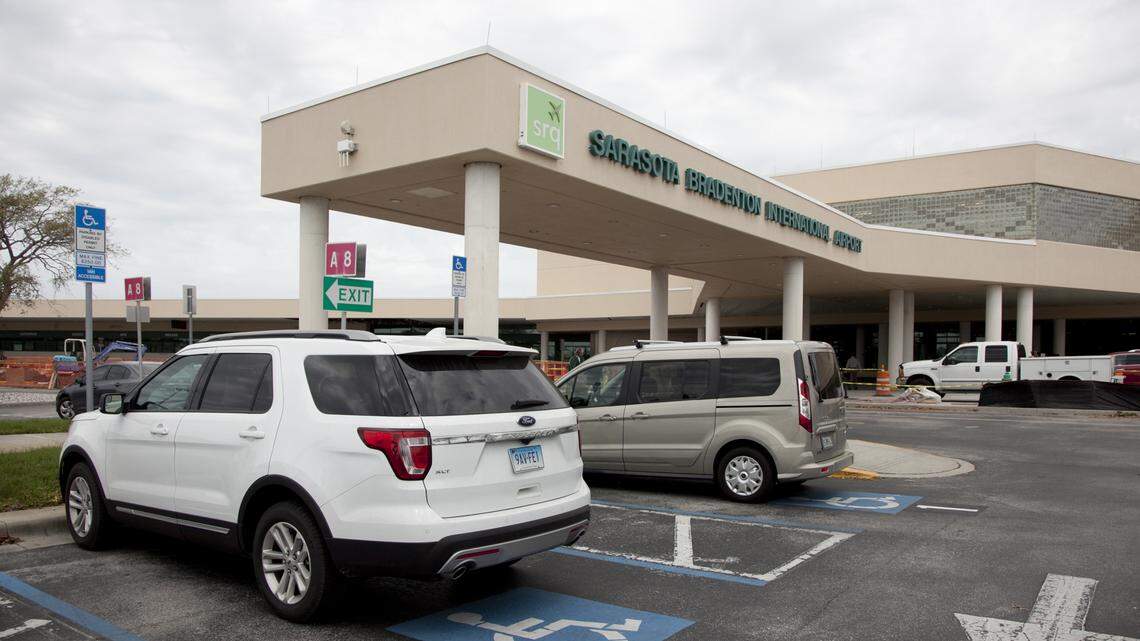 Parking spots close to a covered walkway in front of Sarasota-Bradenton International Airport are as close as the airport comes to having covered parking now. The airport plans to build covered parking for several hundred vehicles starting sometime this year. MATT M. JOHNSON/Bradenton Herald