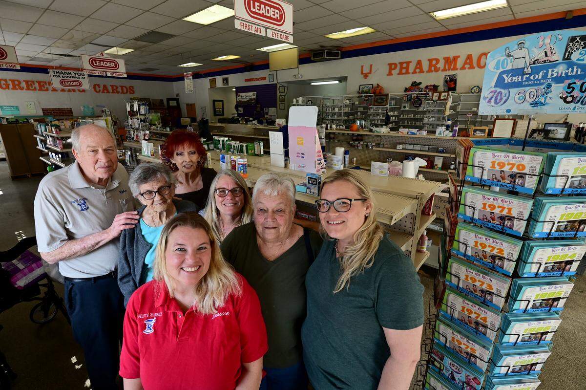 In back, Robert Pelot, Sandy Waldron, Mary Furman, Amy Tindell, Donna Pelot, Erin Sturtevant in glasses and Jessica Bachmeier in red. The group gathered for a photo on Pelot’s Rexall Pharmacy in downtown Bradenton’s last day of business after over 130 years. Shown on March 4, 2026.