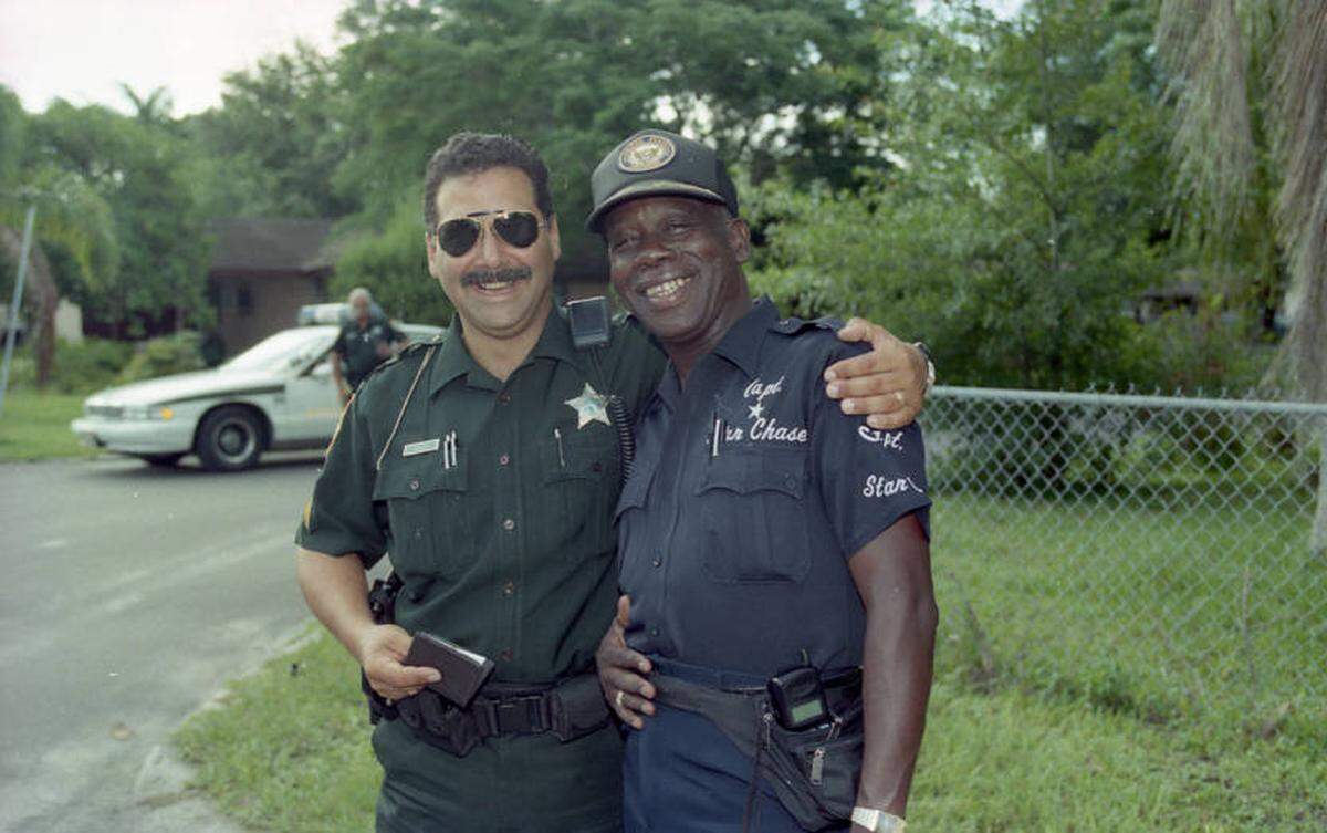 Deputy McArthur Sellars and Willie Clemons Jr celebrate Juneteenth, the two men were a part of a group who planned the first-ever Juneteenth festival in Bradenton. The event was covered by the Bradenton Herald in 1996.