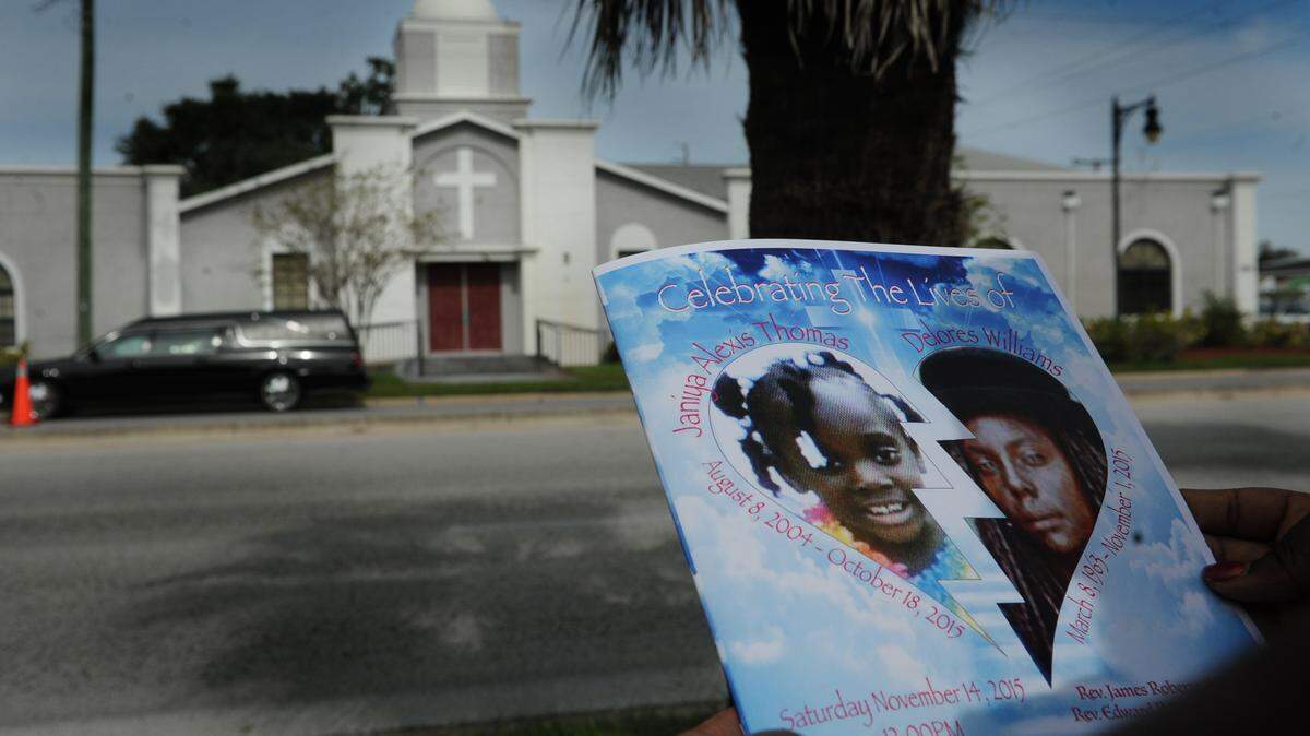 The pictures of Janiya Thomas, 11, and her grandmother, Delores Williams, 52, are displayed on a program at their funeral service at the St. Paul Missionary Baptist Church on Nov. 14. Janiya's body was found in a freezer in October after she was missing for almost a year. 
 GRANT JEFFERIES/Bradenton Herald