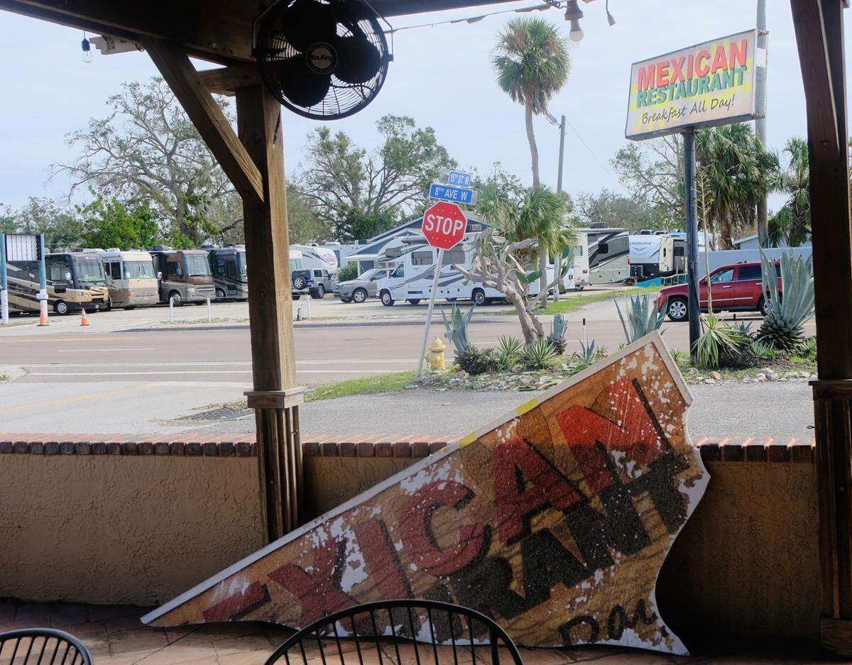 Pieces of signage were scattered around Alvarez Mexican Restaurant in Palmetto after Hurricane Milton peeled off part of the restaurant’s roof. Friday, Oct. 11, 2024.
