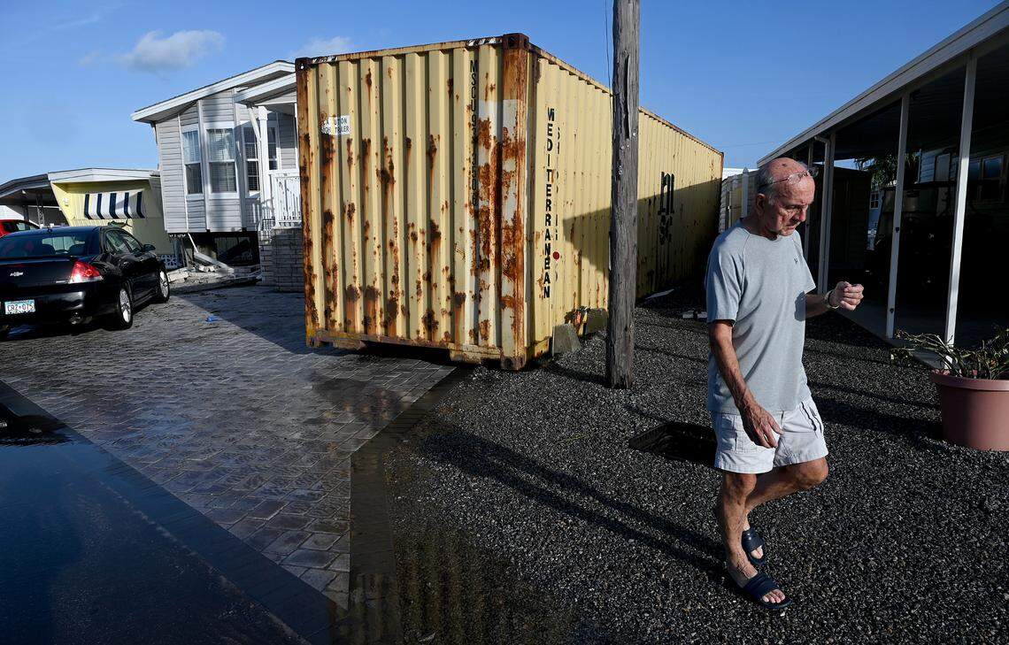 Pete Thornton returned to his mobile home after evacuating to discover a shipping container had floated into his home, damaging the foundation, in the aftermath of Hurricane Helene in Manatee County on Friday, Sept. 27, 2024.