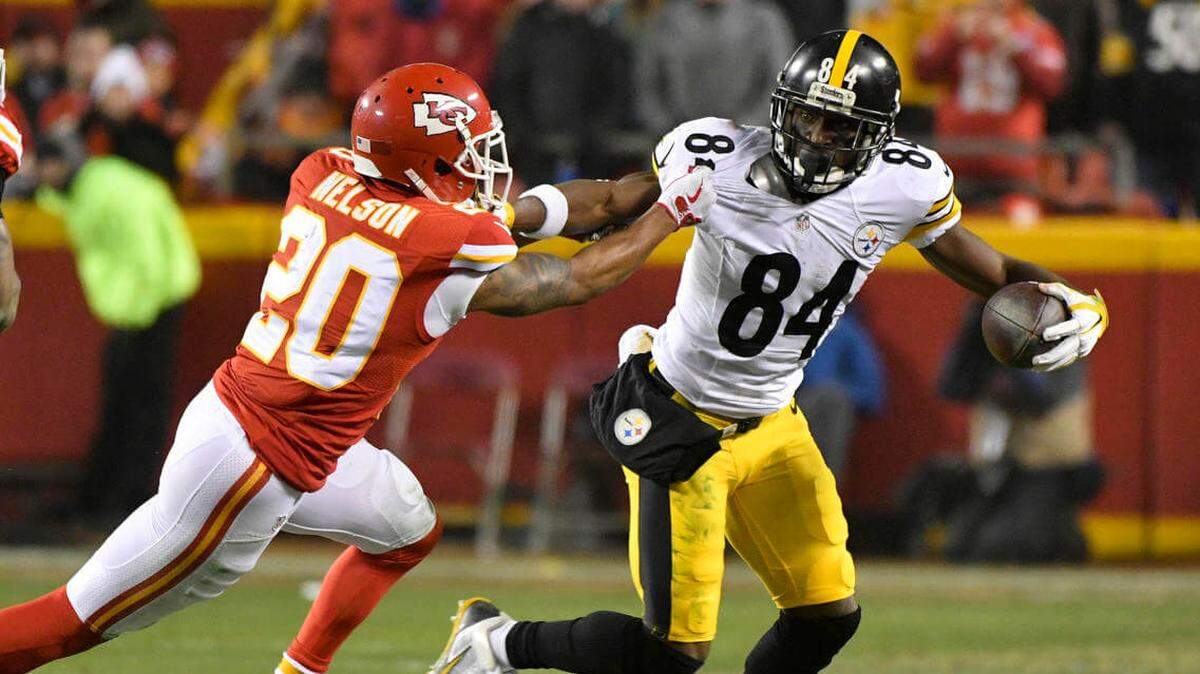 In this file photo, Pittsburgh Steelers wide receiver Antonio Brown (84) breaks a tackle by Kansas City Chiefs cornerback Steven Nelson (20) after making a reception during the first half of an NFL divisional playoff game in 2017.