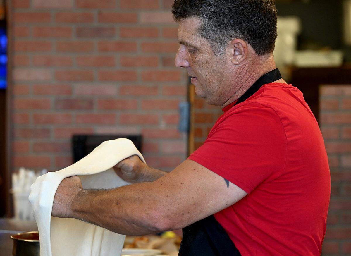 Owner Mark Nilsen makes pizza at the new Cornerstone Pizza at 5203 Cortez Road West on Dec. 10, 2025.