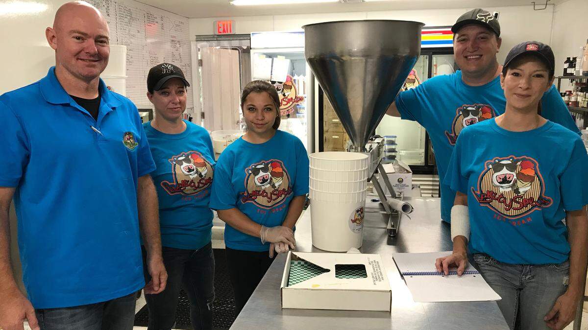 Making cotton candy, double fudge brownie, mint chocolate chip, and other flavor ice creams at the Lickity Splits plant on Thursday were, from left, Matt Eastman, Crystal Stephens, Kiana Vallor, Franky Mathews, and Brian Brown.