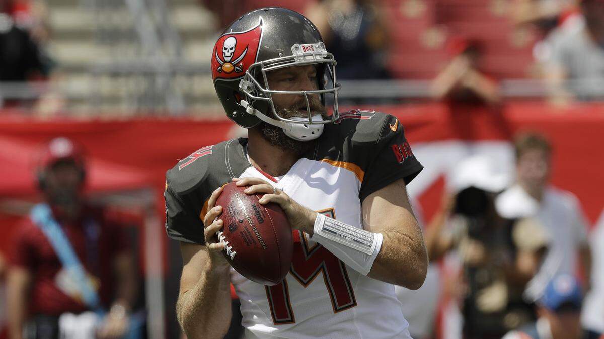 In this Sunday, Sept. 16, 2018 file photo, Tampa Bay Buccaneers quarterback Ryan Fitzpatrick (14) looks to pass during the first half of an NFL football against the Philadelphia Eagles in Tampa. So much for struggling without Jameis Winston. Ryan Fitzpatrick and a talented collection of playmakers that include DeSean Jackson, Mike Evans, O.J. Howard and Chris Godwin, the Bucs (2-0) are off to their best start in eight years and have the NFL’s top-ranked offense.