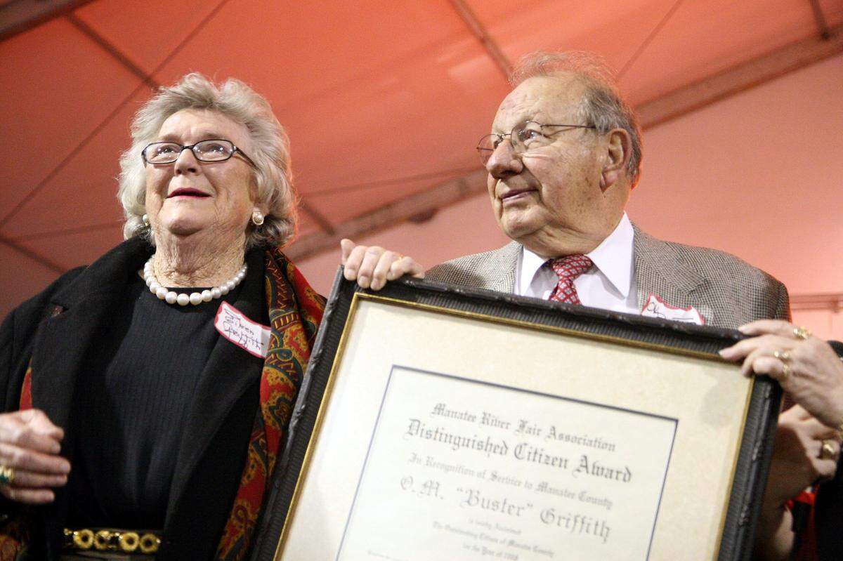 11/6/2008--Accompanied by his wife, Eileen, O.M. “Buster” Griffith accepts the 2008 Manatee River Fair Association’s Distinguished Citizen Award.