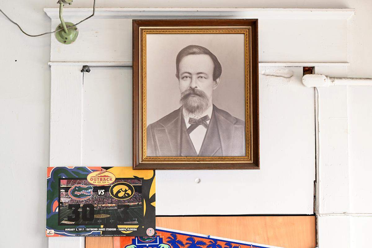 A framed photo of John Crews, reportedly Manatee’s first doctor, hangs on the wall. Pelot’s Rexall Pharmacy in downtown Bradenton closed its doors on Wednesday after over 130 years in business. Shown on March 4, 2026.