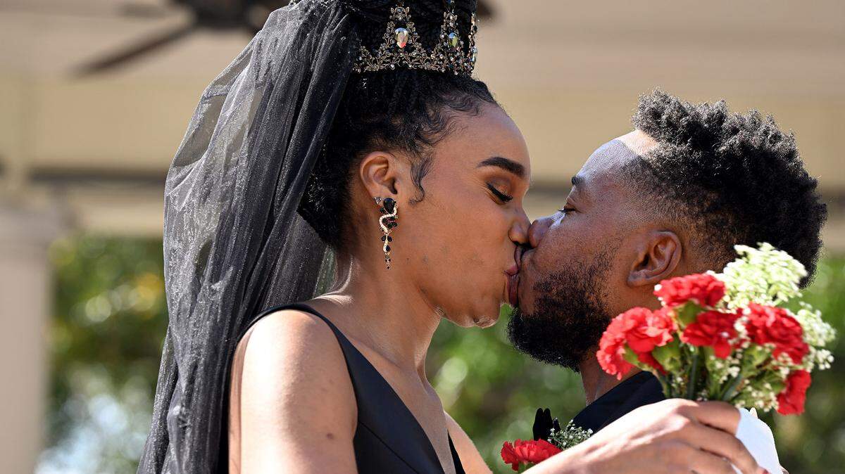 Melaine Fowler and Dion Parrish share a kiss after saying “I do” in a Valentine’s Day group wedding ceremony beside the Historic Manatee County Courthouse on Wednesday, Feb. 14, 2024.