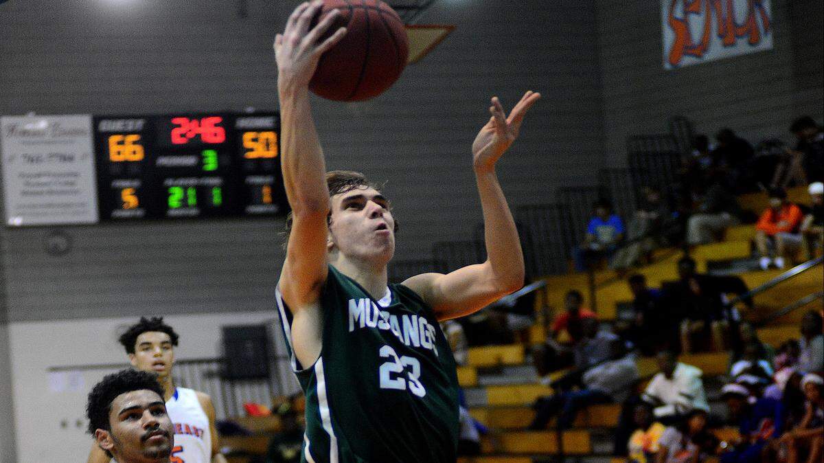 Brock Sisson (23) scored 9 points, all three pointers, in the first but was shut out in the second. The Lakewood Ranch Mustangs defeated the Southeast Seminoles 96-78 in boys basketball action at Southeast High School on Thursday evening December 17, 2015. 
 DAVID W DOONAN | Special To The Herald