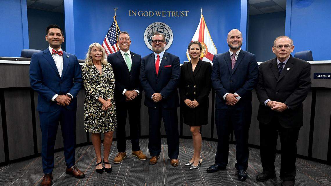 The new Manatee County Board of Commissioners, Tal Siddique, Carol Ann Felts, George Kruse, Mike Rahn, Amanda Ballard, Jason Bearden and Robert McCann after a swearing-in ceremony in the chambers.