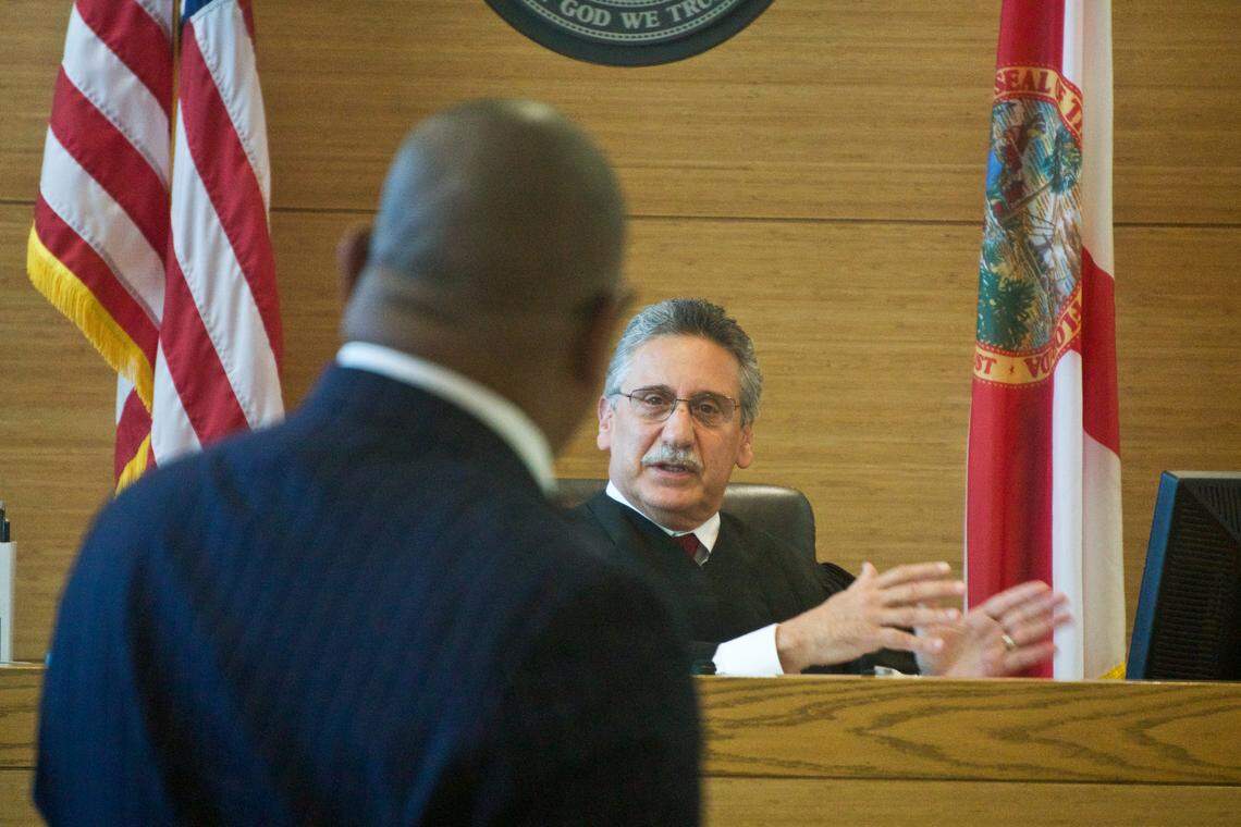 Robert Cohen, an administrative law judge with the Division of Administrative Hearings, addresses Christopher Norwood, a representative for Lincoln Memorial Academy, on Aug. 26, 2019.