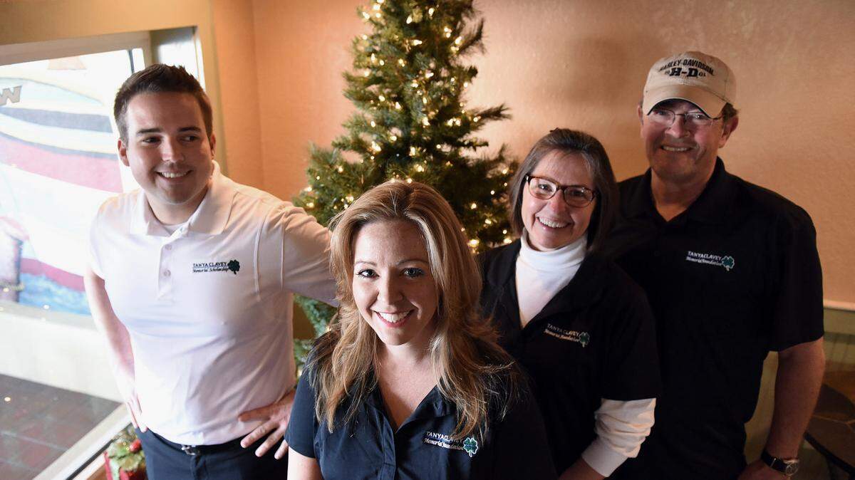 Members of the Tanya Clavey Memorial Foundation board, Adam Spatafora, Erin Womack and Penny and Mike Johnston, gather for a photo at Java N Jive in Palmetto. The group, founded by Spatafora in memory of his sister who was killed by a drunk driver, is raising money towards the education of a local law enforcement student in her honor. 
 TIFFANY TOMPKINS-CONDIE/Bradenton Herald