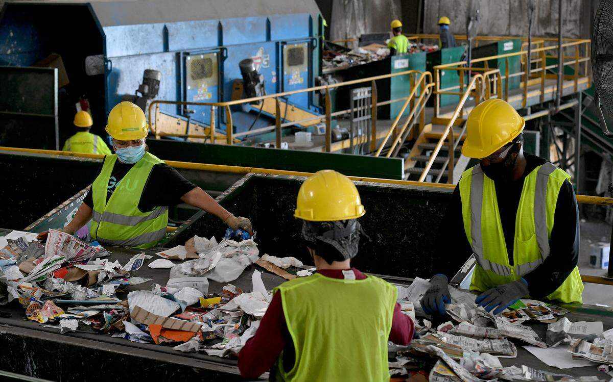 Workers sort through recycling at Waste Pro at 7921 15th Street East, Sarasota.
