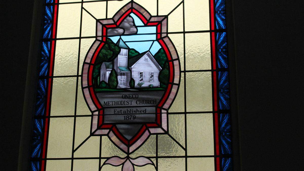 One stained glass window at Oneco United Methodist Church depicts an earlier version of the church building.JAMES A. JONES JR./Bradenton Herald