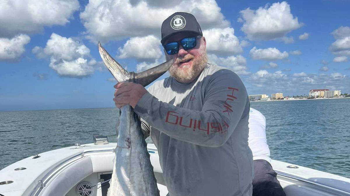 Brian Hasson poses during the 2022 Old Salt Fall King of the Beach Kingfish Tournament with his winning 39 pound kingfish caught off Johns Pass.