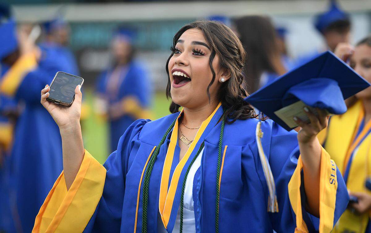 06/03/21—Marleny Merida reacts in joy at Bayshore High School’s commencement ceremony at LECOM Field.