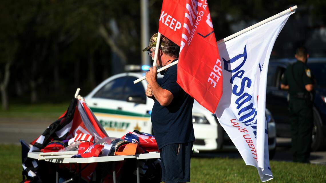 A vendor sells Ron DeSantis flags, hats and other keepsakes before the governor’s Don’t Tread on Florida Tour in Sarasota on Sunday, Nov. 6.