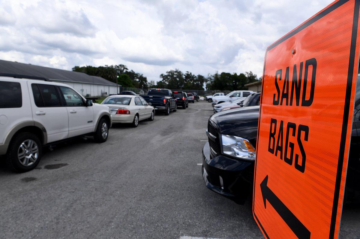 FILE--Cars waited in line for sandbags in Palmetto as residents prepared for Hurricane Dorian in 2019 in this Bradenton Herald file photo.