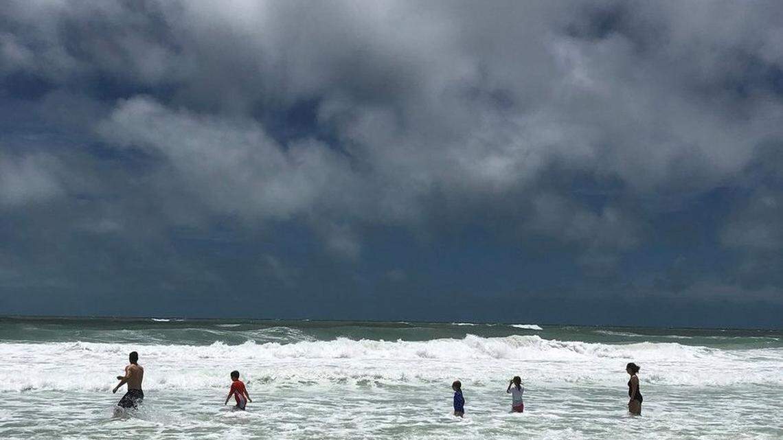 Despite strong winds and surf associated with Subtropical Storm Alberto, crowds did flock to Anna Maria Island on Sunday afternoon soak in the rays. A few brave souls even ventured into the water.