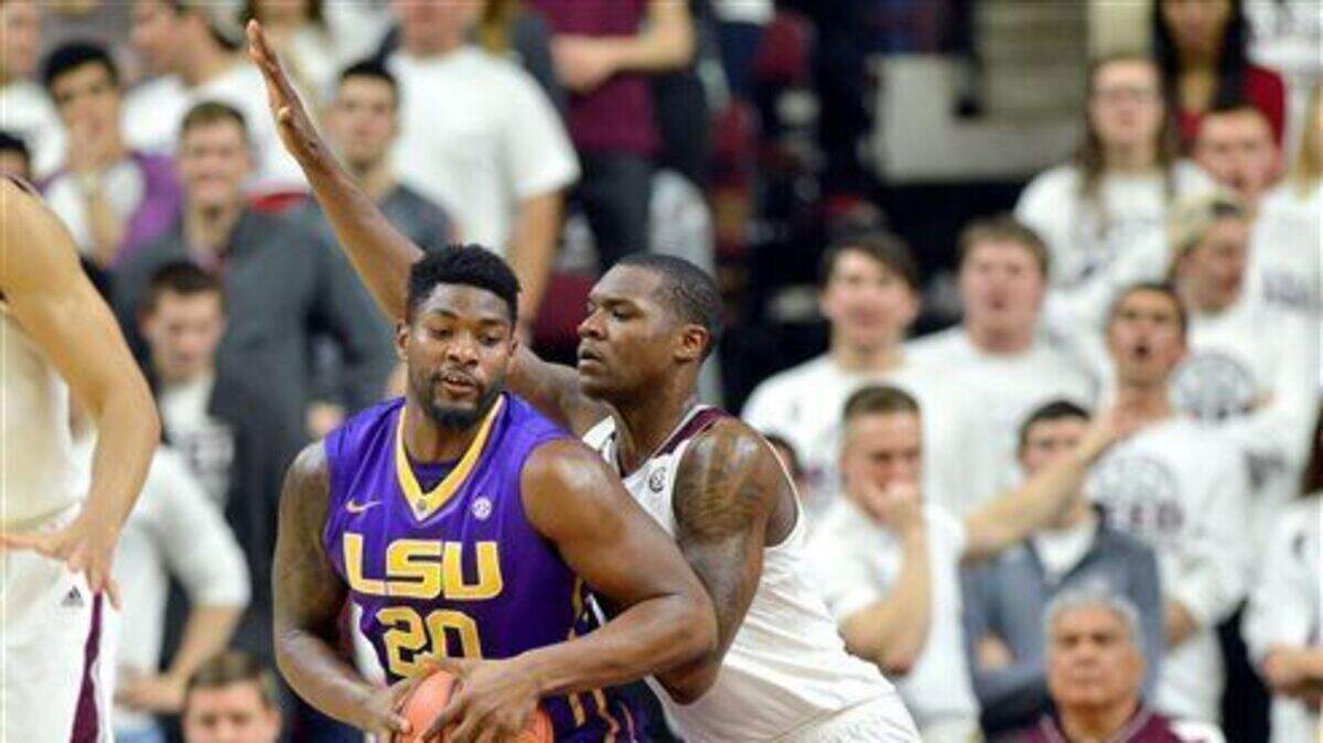 LSU's Brian Bridgewater (20) tries to get around Texas A&M's Jalen Jones (12) during the first half of a NCAA college basketball game Tuesday, Feb. 17, 2015, in College Station, Texas.