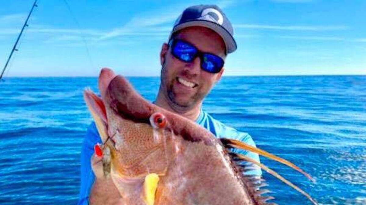 Jon Chapman shows off a hogfish caught Tuesday about 16 miles from shore in the Gulf of Mexico.