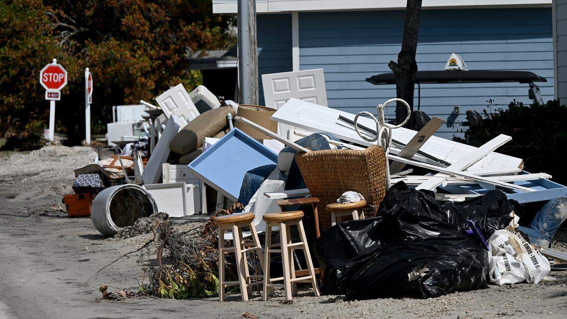 Belongings stacked in front of a flood-destroyed home in Bradenton Beach after Hurricane Helene on Oct. 2, 2024.