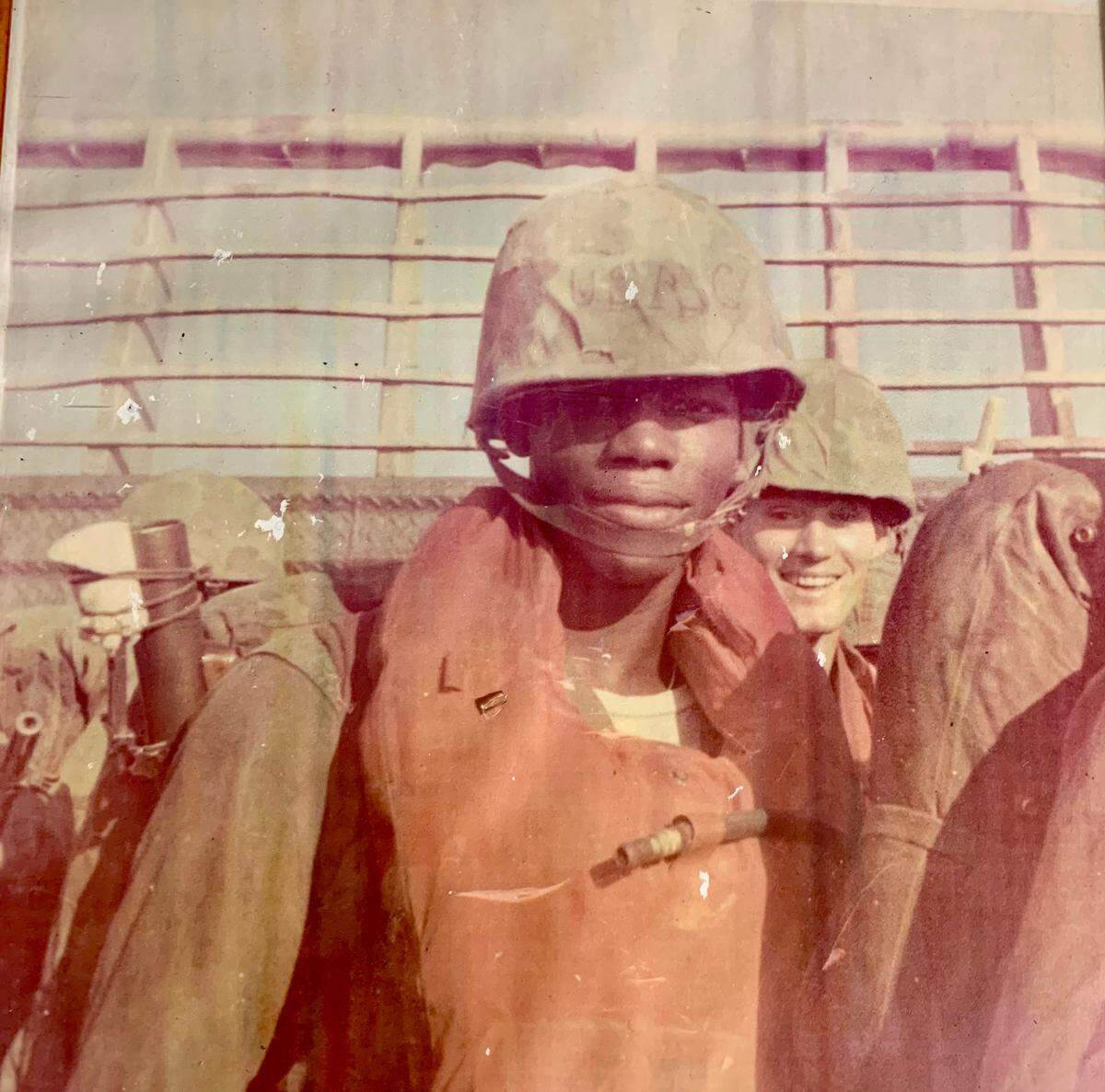 Edward Brown, left, enlisted in the Marines at age 17 and served in Vietnam, where he was wounded in action. He is returning to his old Palmetto neighborhood this week, distributing vouchers to residents for a special Thanksgiving he has planned.