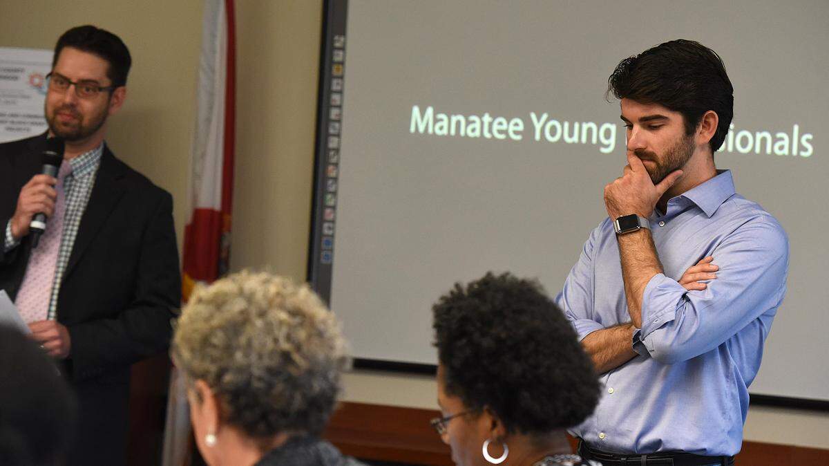Stewart Moon, right, of Manatee Young Professionals gives a presentation Tuesday during the Manatee County Commission affordable workforce housing discussion.TIFFANY TOMPKINS/Bradenton Herald