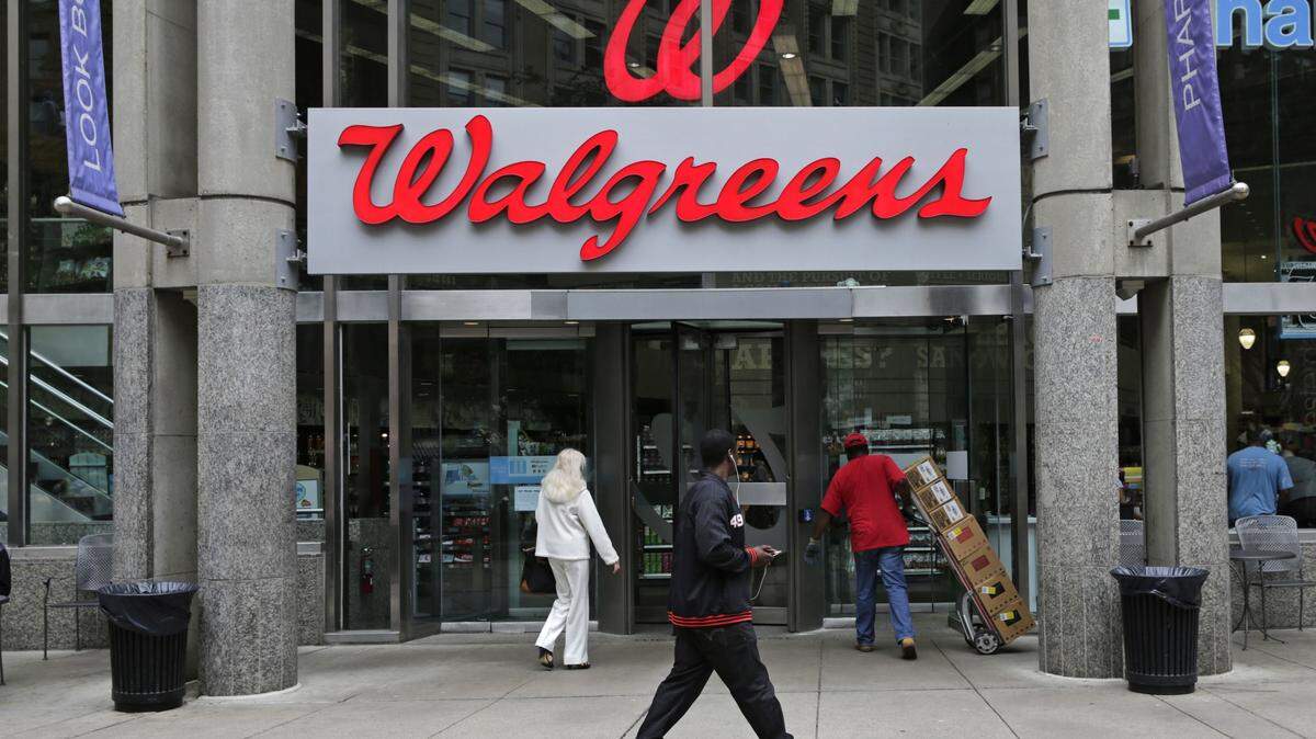 FILE - This June 4, 2014, file photo shows a Walgreens retail store in Boston. Walgreens confirmed Tuesday, Oct. 27, 2015, that it will buy rival Rite Aid, creating a drugstore giant with nearly 18,000 stores around the world. (AP Photo/Charles Krupa, File)