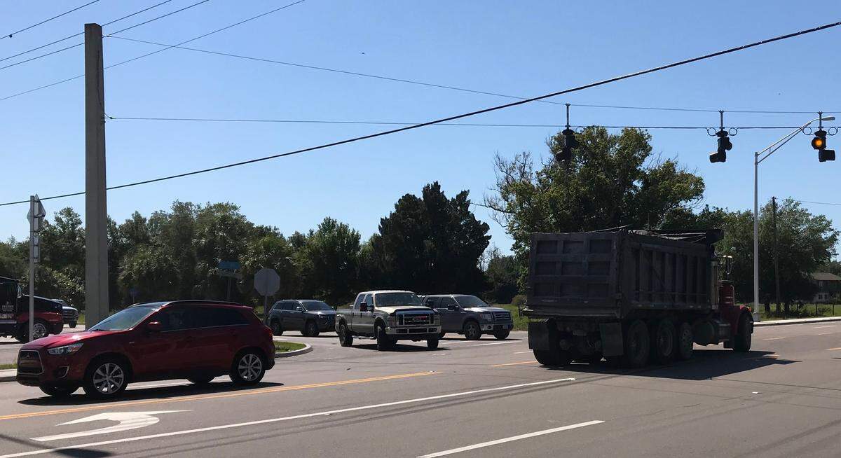 Absent a fully functioning traffic signal at the intersection of County Road 675 and U.S. 301, drivers look for a gap in traffic and try to judge the speed of oncoming vehicles before making a turn.