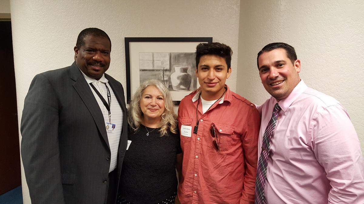 Omar Edwards, Principal Horizons Academy; Flora Goodwins (Teacher, Horizons Academy); Carlos Alfaro, 12th grade Horizons Academy; Ryan Clarke, Asst. Principal Horizons Academy post for a photo at the recent Superintendent's Art Gallery. PHOTO PROVIDED